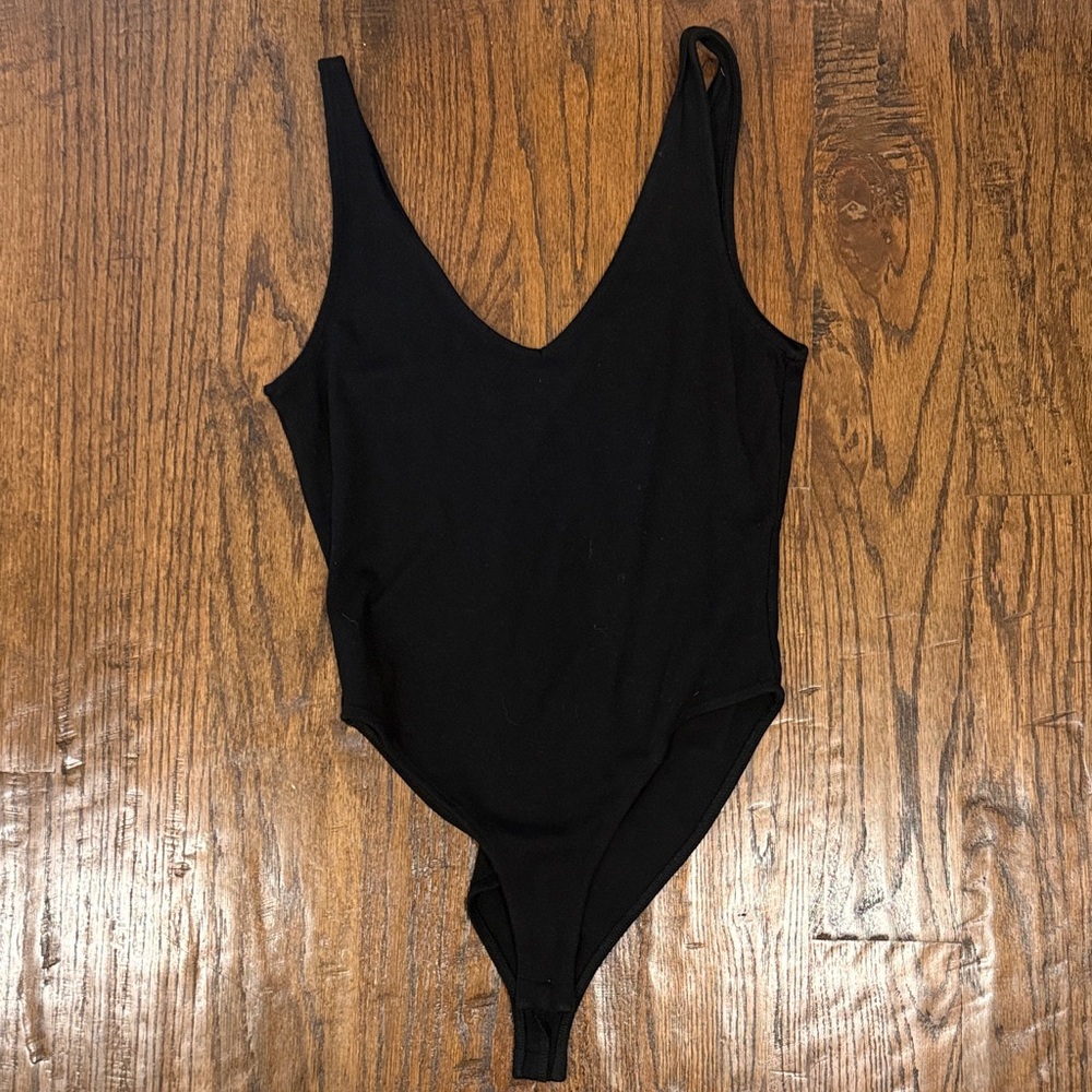 Forever 21 simple  Black One-Piece v-neck Bodysuit